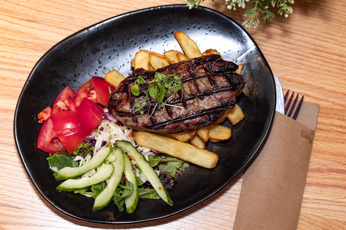 Grilled sirloin with chips and salad