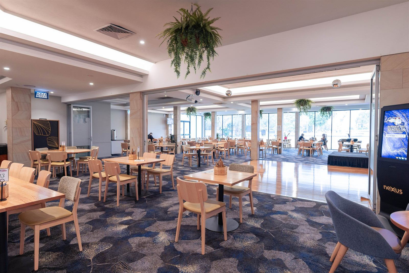 The restaurant dining area with windows overlooking the home ground
