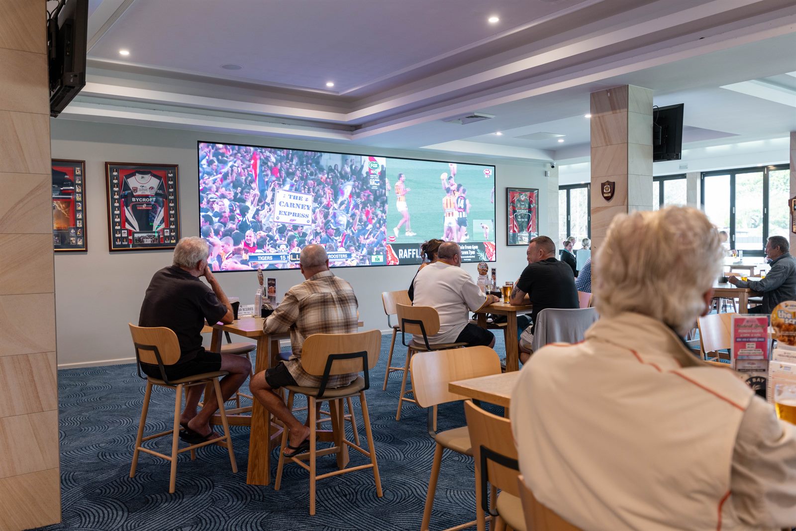 The sports bar with the game on the big screen